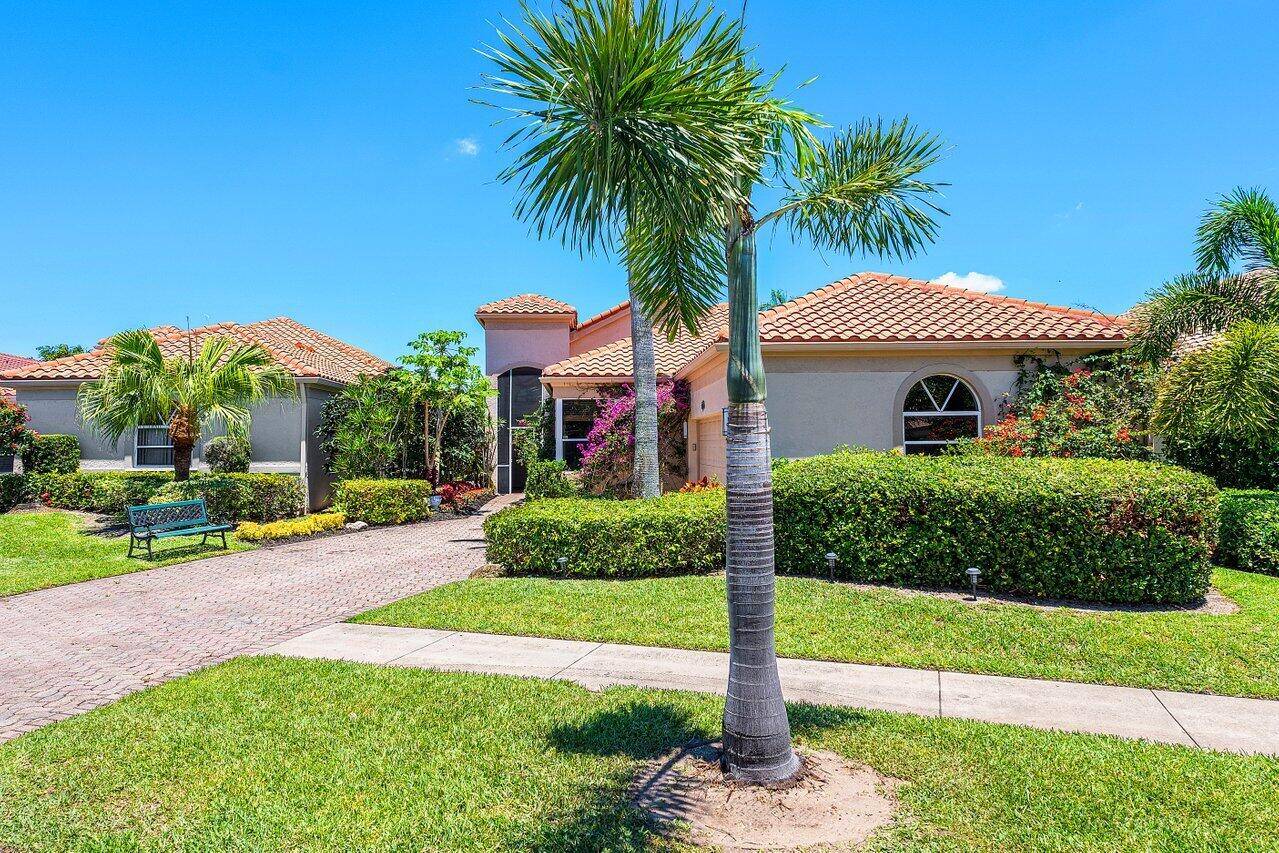 AMAZING GOLF COURSE AND WATER VIEWS UPON ENTERING THIS ONE STORY HOME WITH VOLUME CEILINGS.