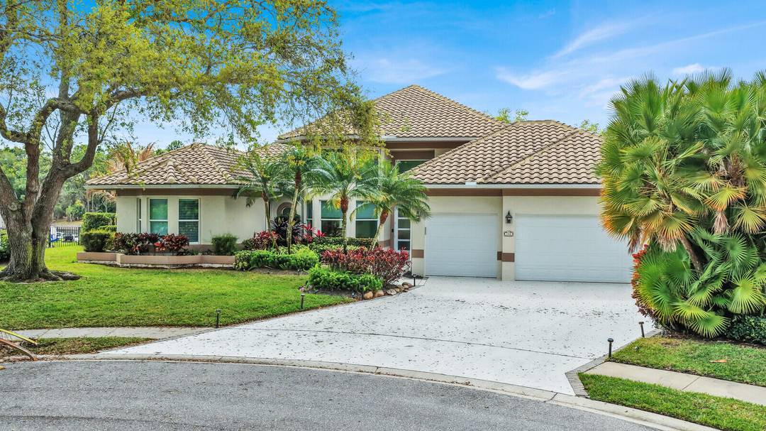 Welcome to 142 Corinthian Circle a stunning lakeview retreat nestled within the prestigious gated community of North Fork in the Shores of Jupiter.
