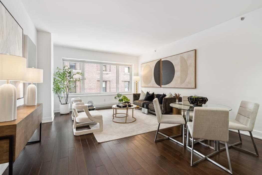 Indulge in luxurious living within this exquisite two bedroom, two and a half bath residence, nestled in one of Tribeca's premier boutique buildings.