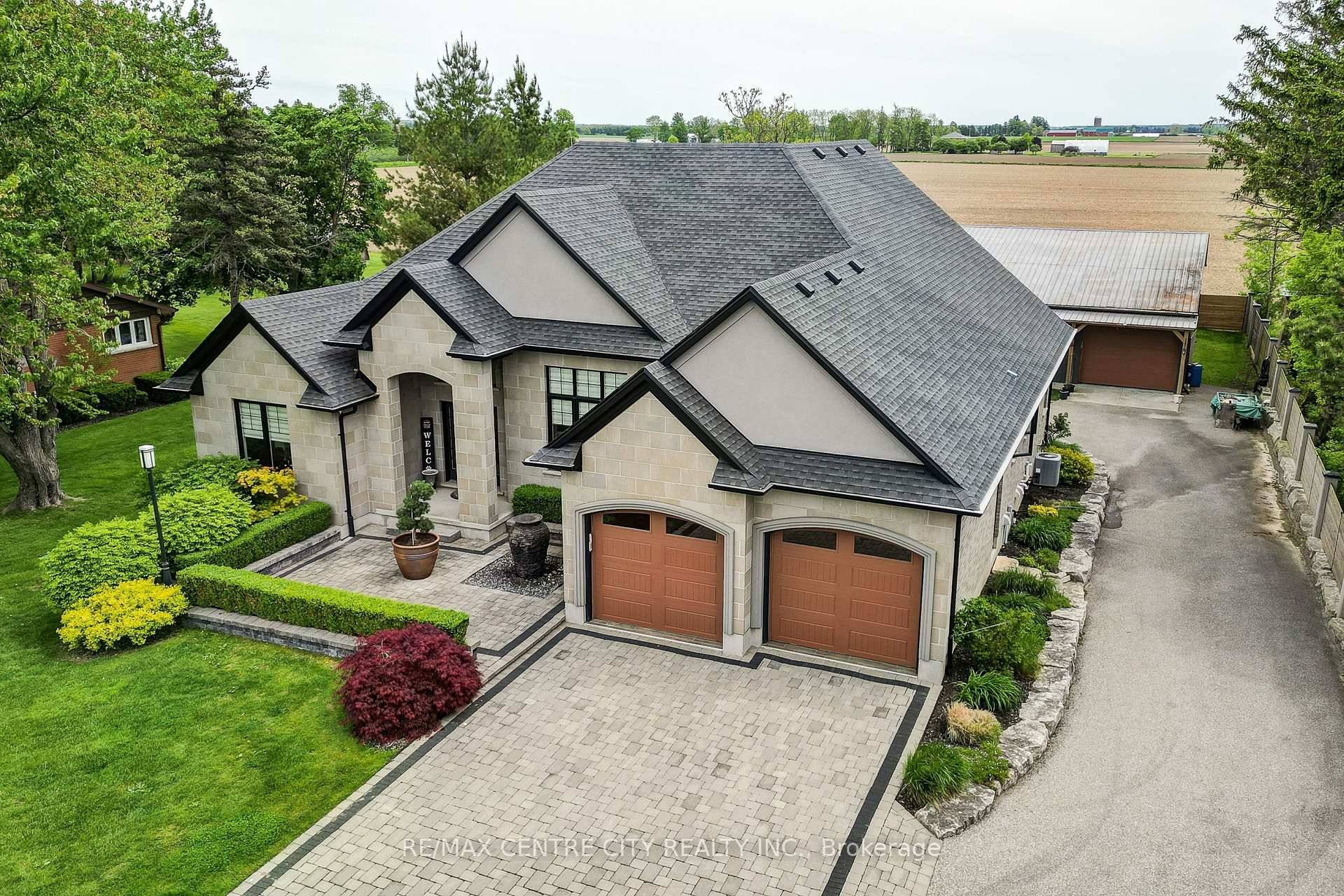 This stunning country retreat boasts luxurious finishes and thoughtful design elements, blending seamlessly into its picturesque surroundings.