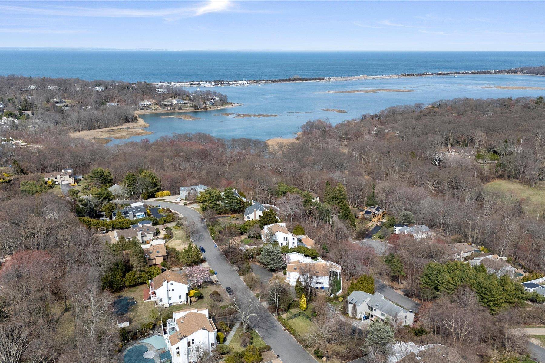 Indulge in breathtaking vistas of Mount Sinai Harbor, the Long Island Sound, and Connecticut from multiple rooms of this extraordinary home.