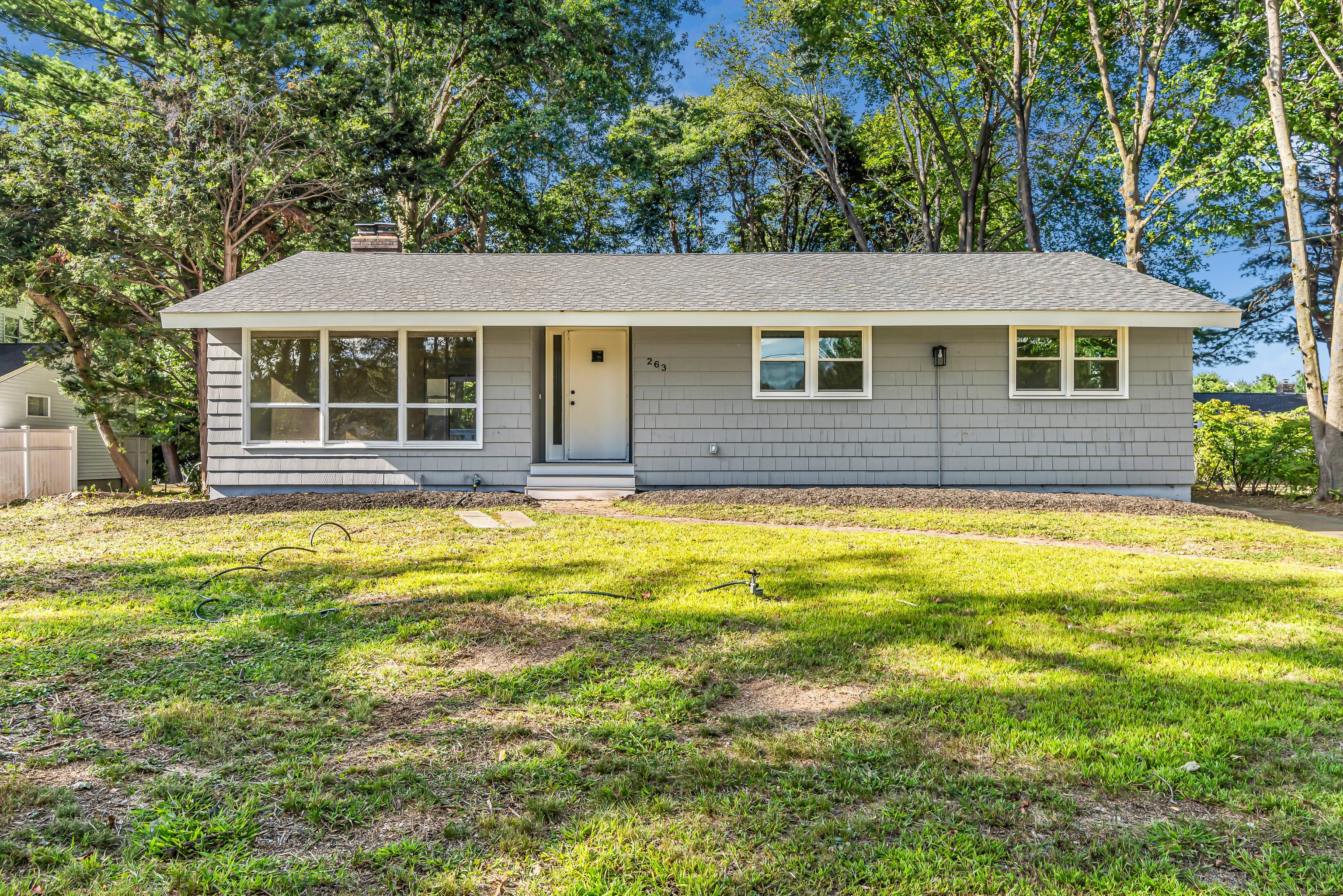Pulling up to 263 Two Rod Highway, you're greeted by a classic ranch style home set back on nearly an acre of land.