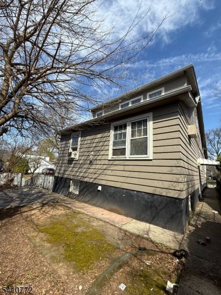 Opportunity knocks in desirable Maplewood with this 2 family fixer upper located on a corner lot with a double garage.