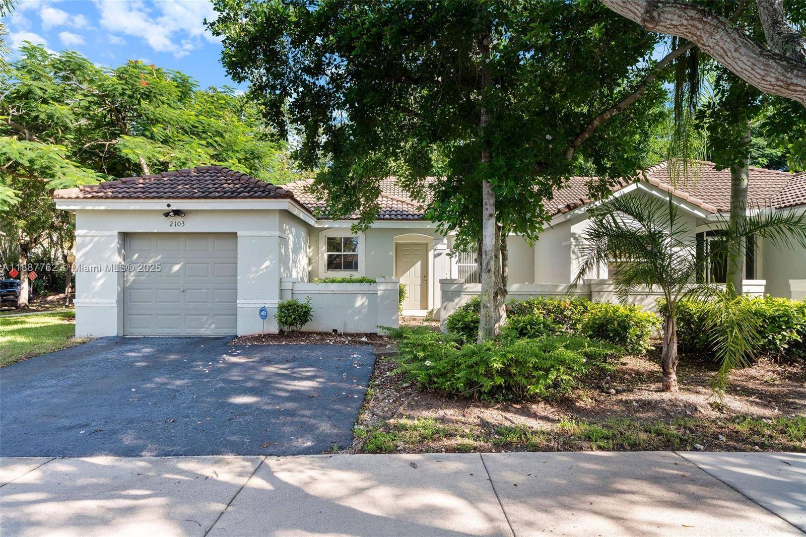 Charming 3 bed 2 bath corner lot home built in 2001 in the gated community of the Hammocks.