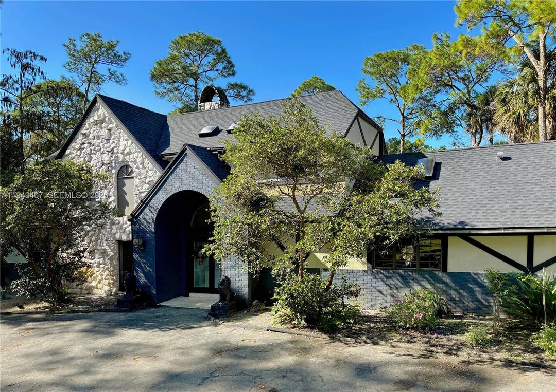 Distinctive Tudor style estate set on 5 acres in the highly desirable Fox Trail Equestrian Community, where all homes sit on five acre parcels, offering privacy and space.