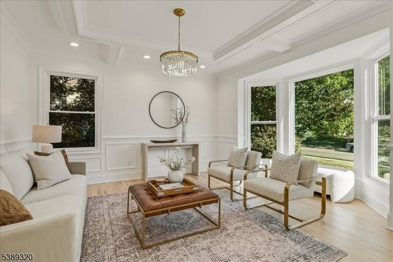 Set within the Grande at Pleasantdale, this meticulously redesigned residence blends timeless architecture with a sophisticated modern aesthetic.