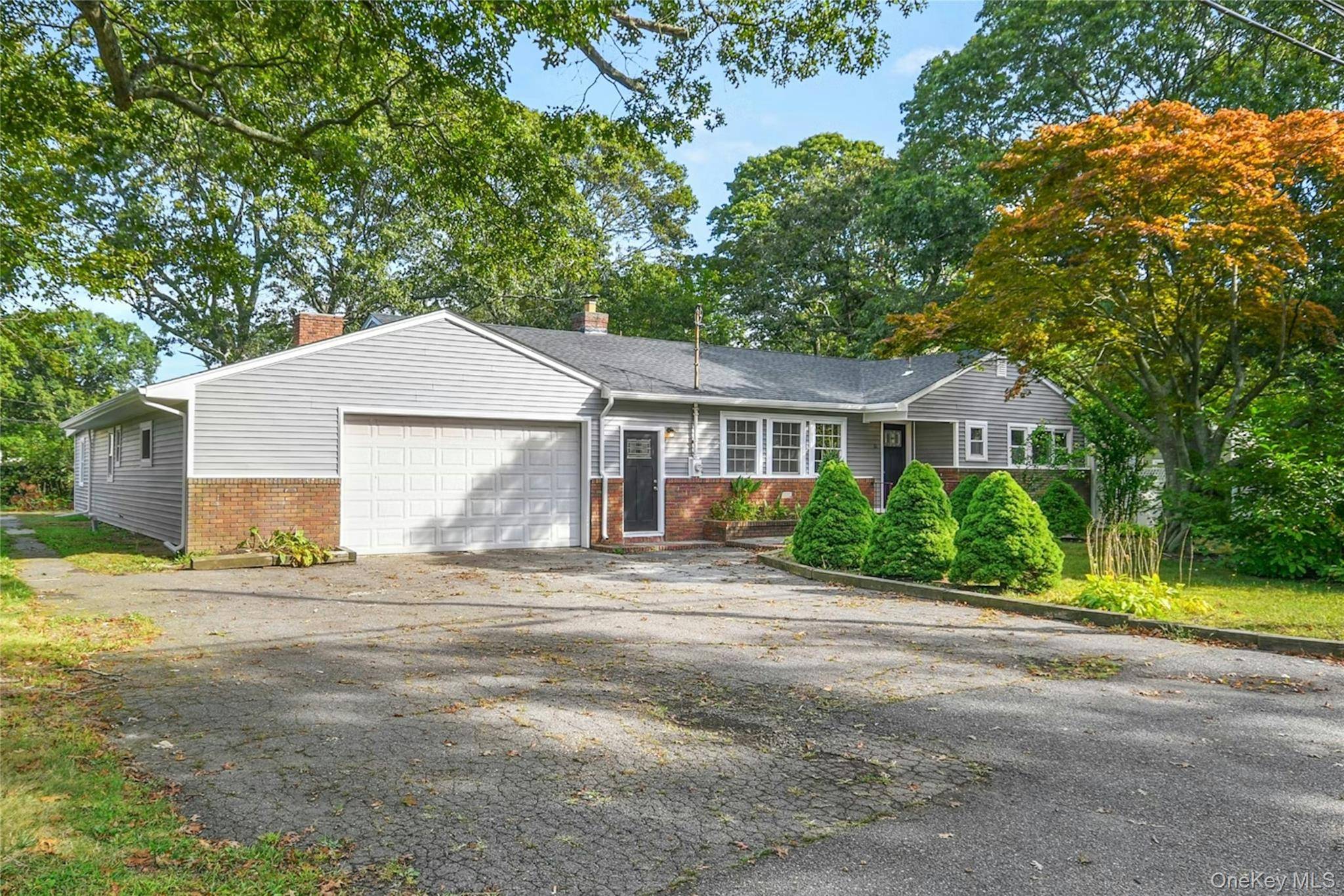 Completely renovated Sprawling Ranch with modern finishings provides a perfect mix of function with style !