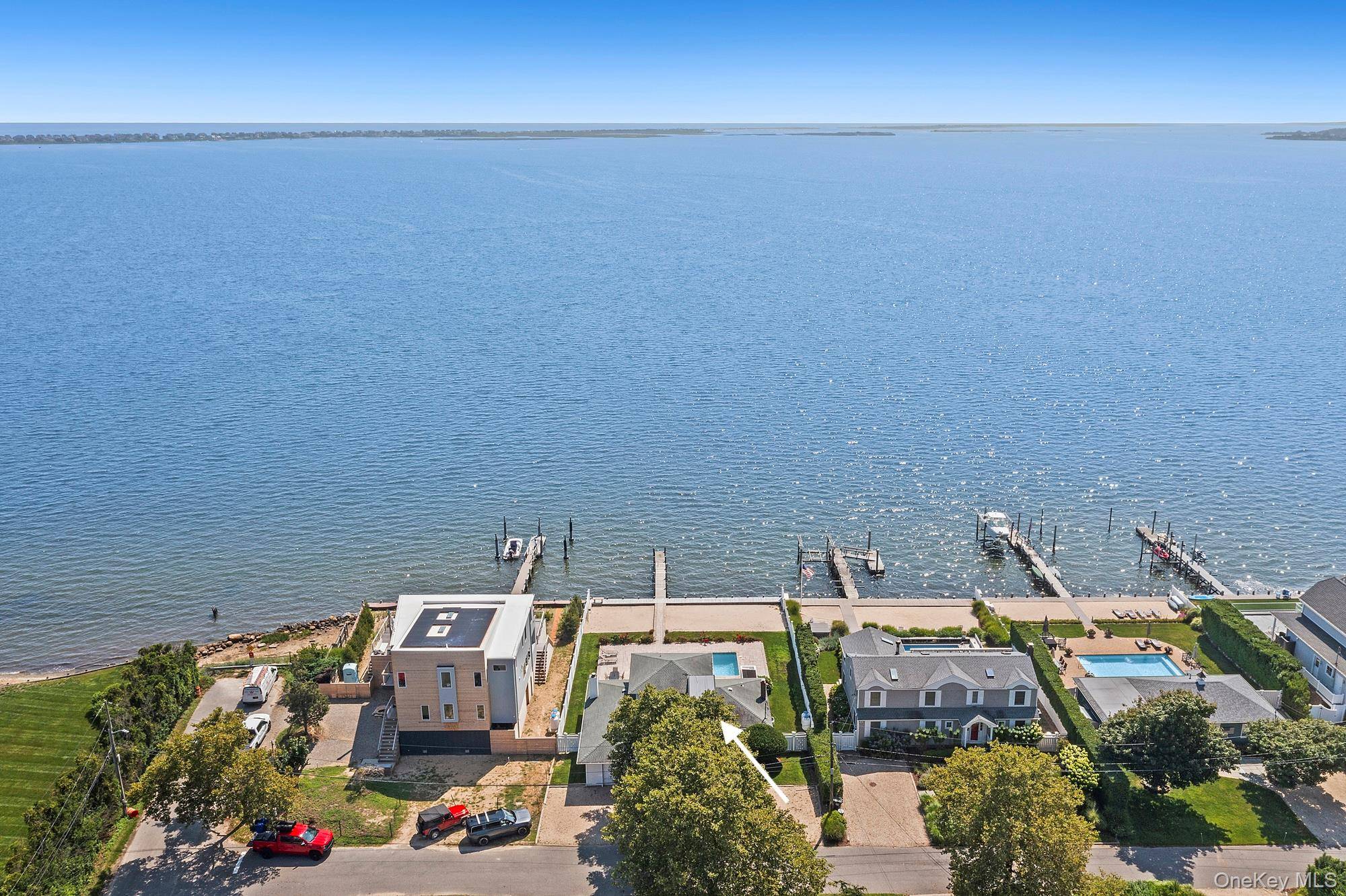 Set on the bay in the coveted hamlet of Remsenburg, 3 Seatuck Lane offers a rare chance to own 75 feet of pristine Moriches Bay frontage with sweeping, unobstructed views.