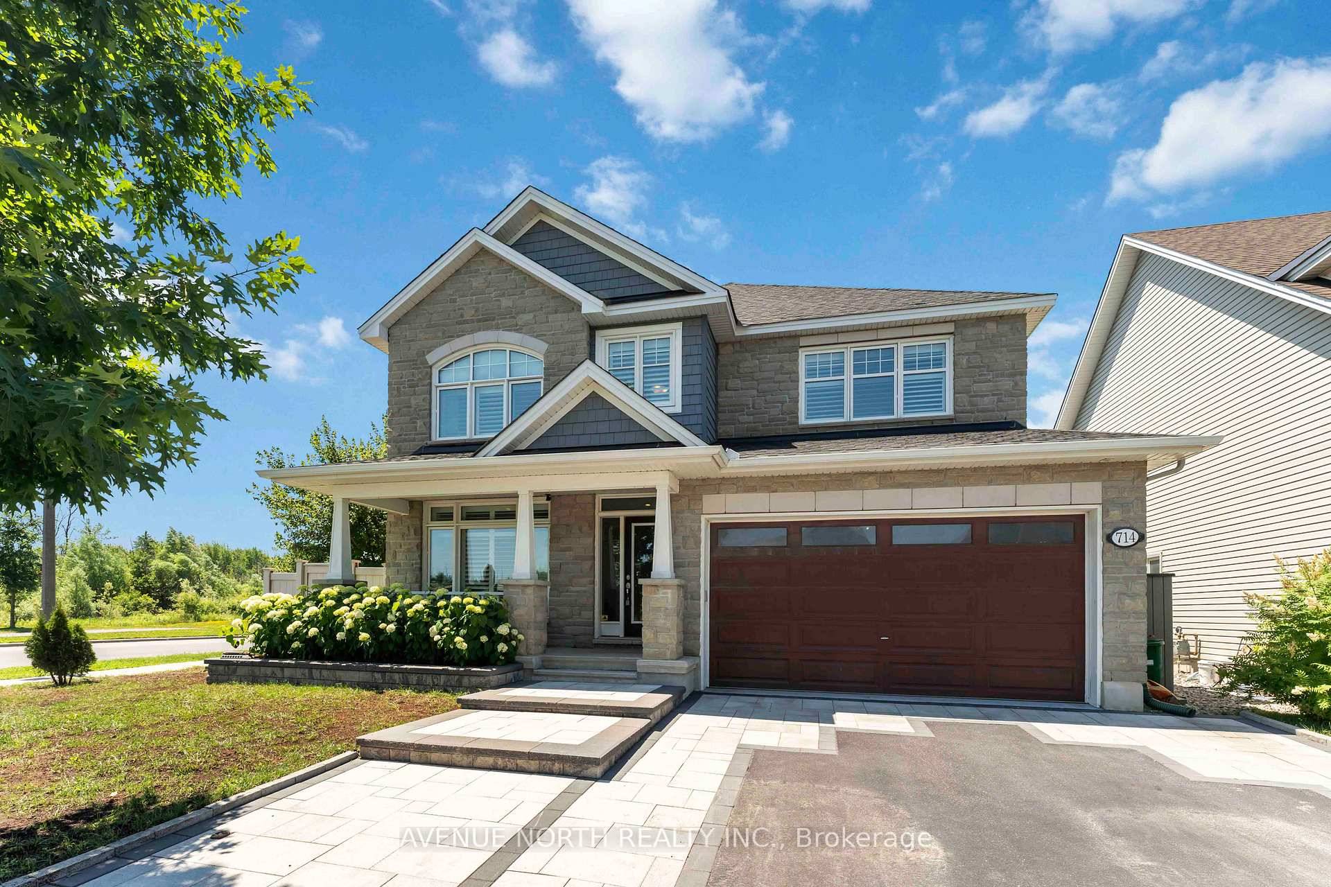Luxurious Former Tamarack Oxford Model Home in Sought After Findlay Creek !
