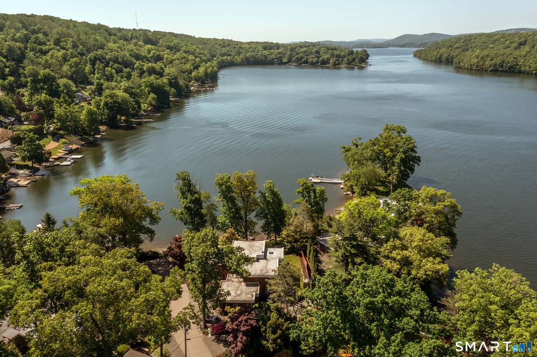 Rare, Level 4 BR, 4 Bath Contemporary Waterfront on Candlewood Lake offering over 3951 SF with amazing southerly views.