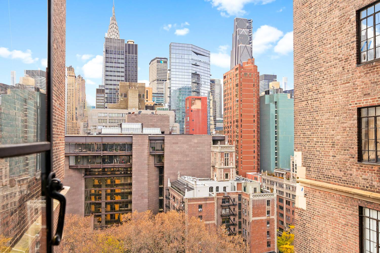 Welcome to 45 Tudor City Pl, Apt 1515 a beautifully renovated and sun drenched 1 bedroom plus convertible bedroom and home office with two full bathrooms.