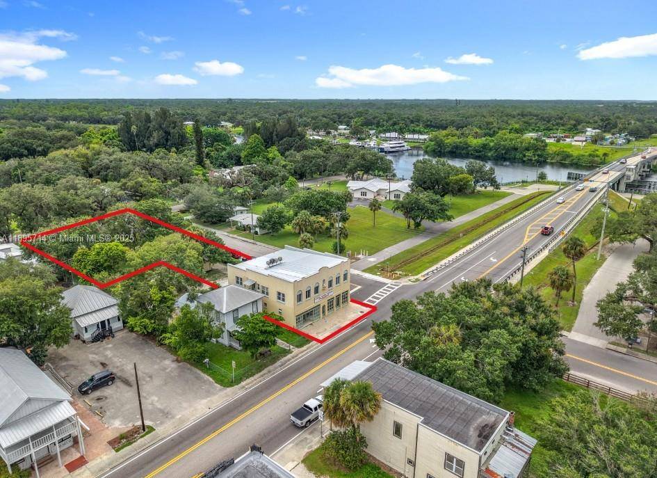 HISTORIC MULTI USE 5400 SF LANDMARK BLDG LOCATED AT FOOT OF BRIDGE ON HIGHWAY 29 AT ENTRANCE OF DOWNTOWN LABELLE !