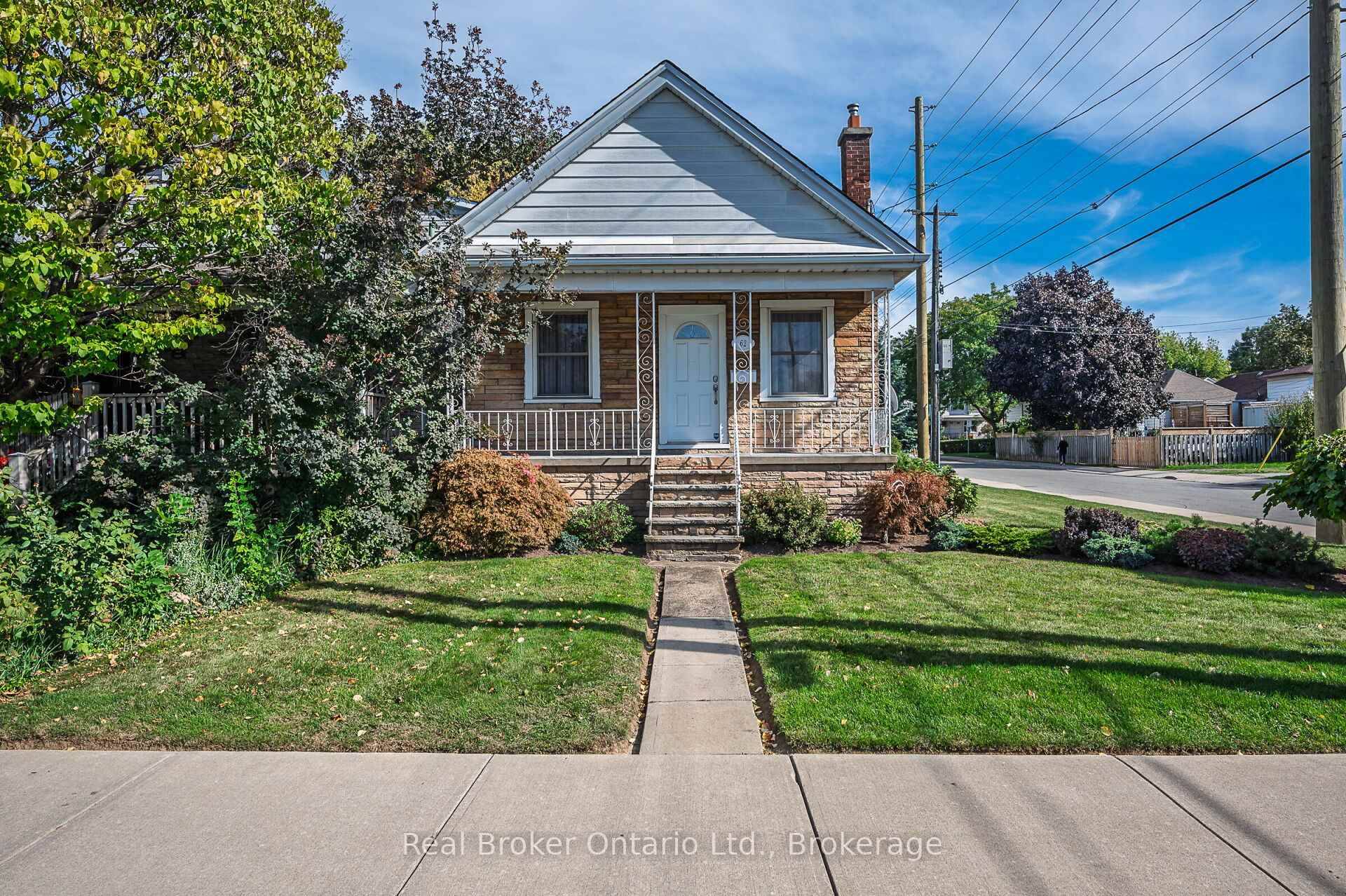 Welcome home to this gorgeous bungalow with incredible curb appeal on a sunny corner lot, wrapped in perennial gardens, a covered front porch, and driveway parking.