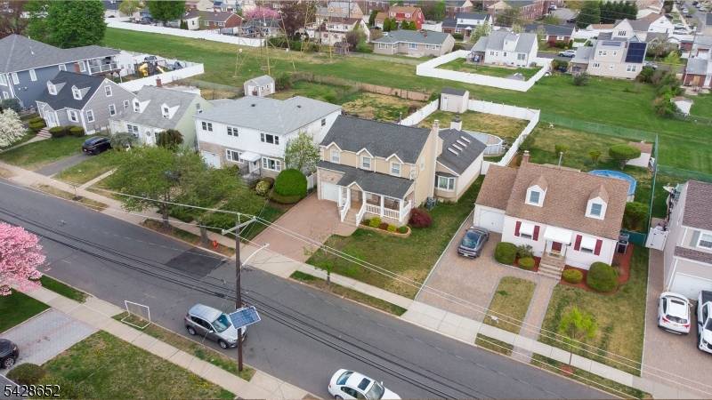 This very desirable colonial home, 2300 SQ FT, is located in a lovely area of North Arlington and features central air throughout.