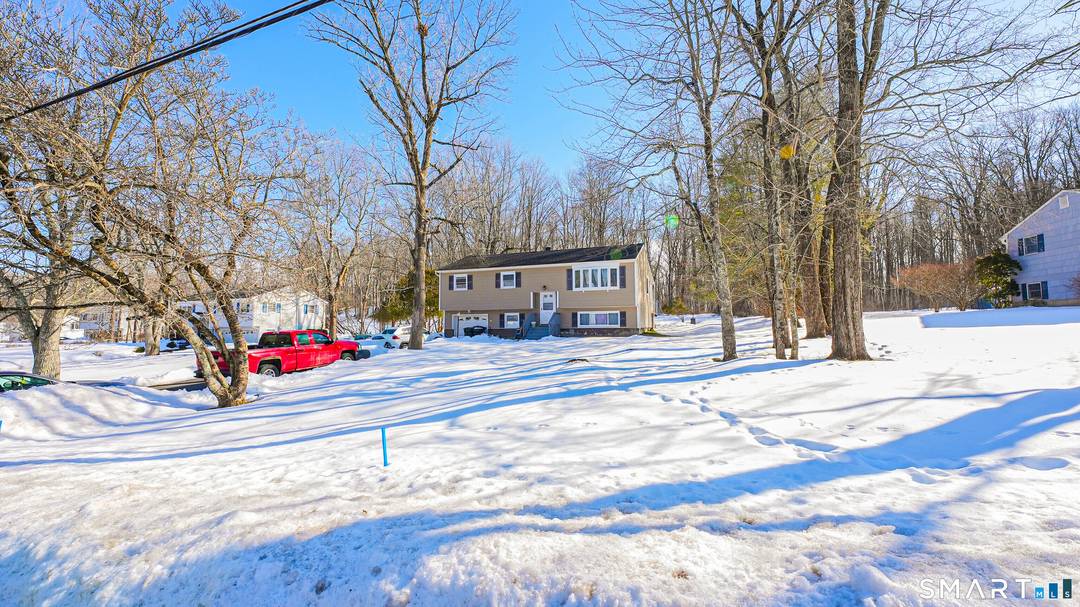 Welcome to this spacious raised ranch located on a quiet residential street in Danbury.