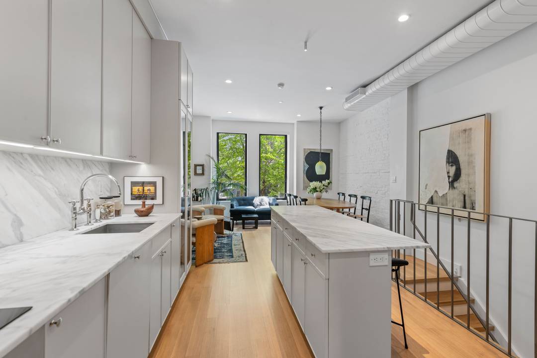 Nestled on a quiet, L shaped tree lined enclave in the heart of Clinton Hill, this interior designer's duplex condo is a rare marriage of historic character and bespoke modern ...