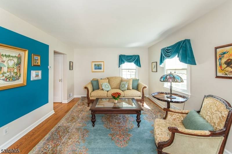 Welcome to this Charming Cape Cod in the Allwood section of Clifton.