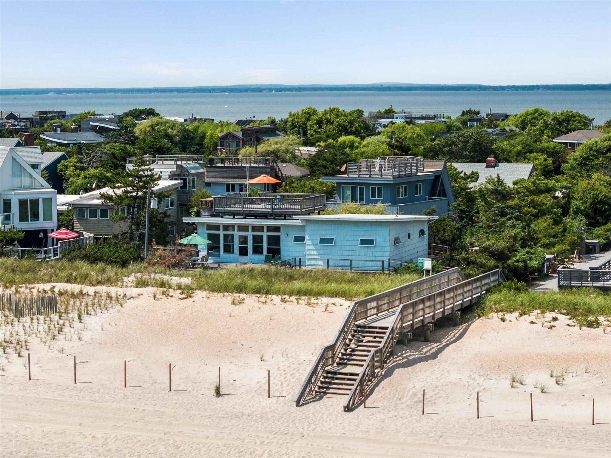 Extraordinary beachfront property nestled in prime Seaview, Fire Island s most sought after community.