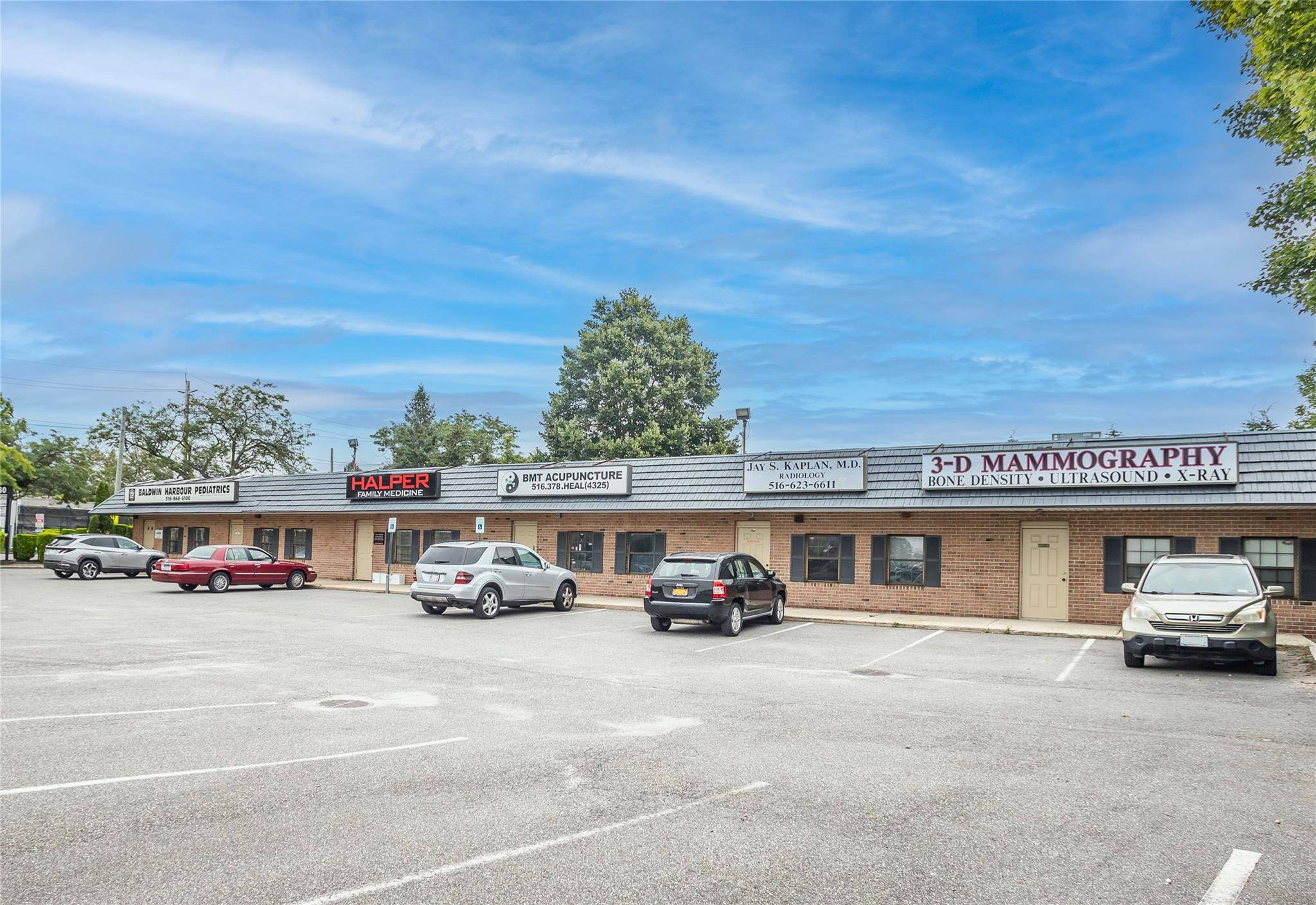 Fantastic income generating property with dozens of parking spaces on a busy thoroughfare.