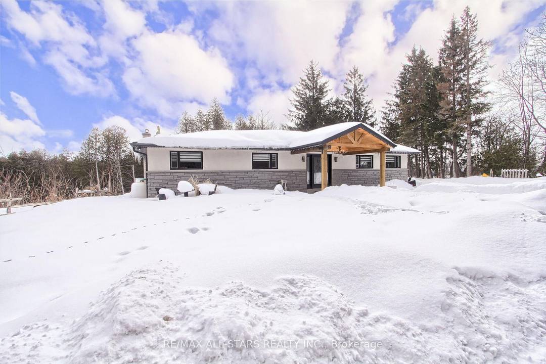 Drive thru your gated tree lined driveway to 10 acres of natures beauty Generous sized 3 bedroom bungalow with a walk out basement.