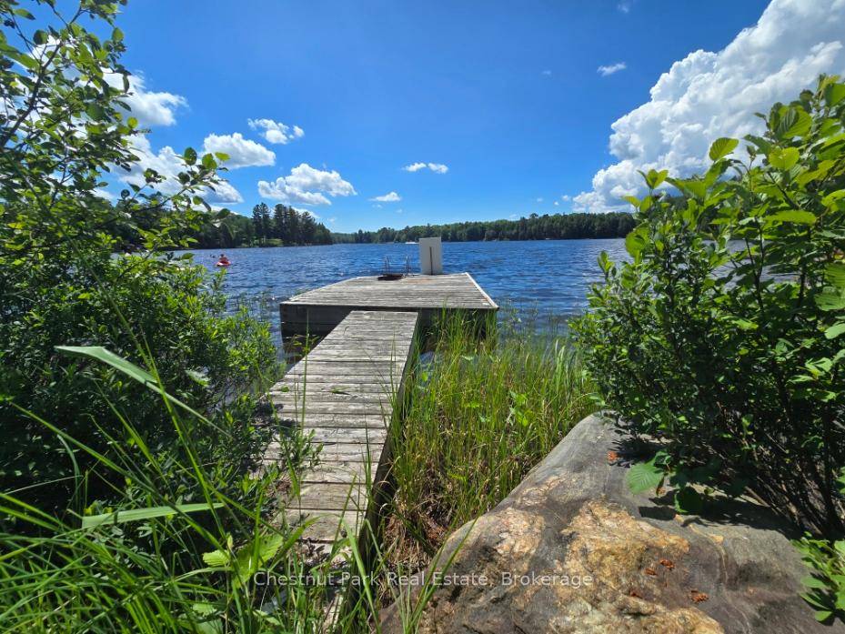Enjoy this west facing waterfront lot, which includes a level building backlot with lake views !