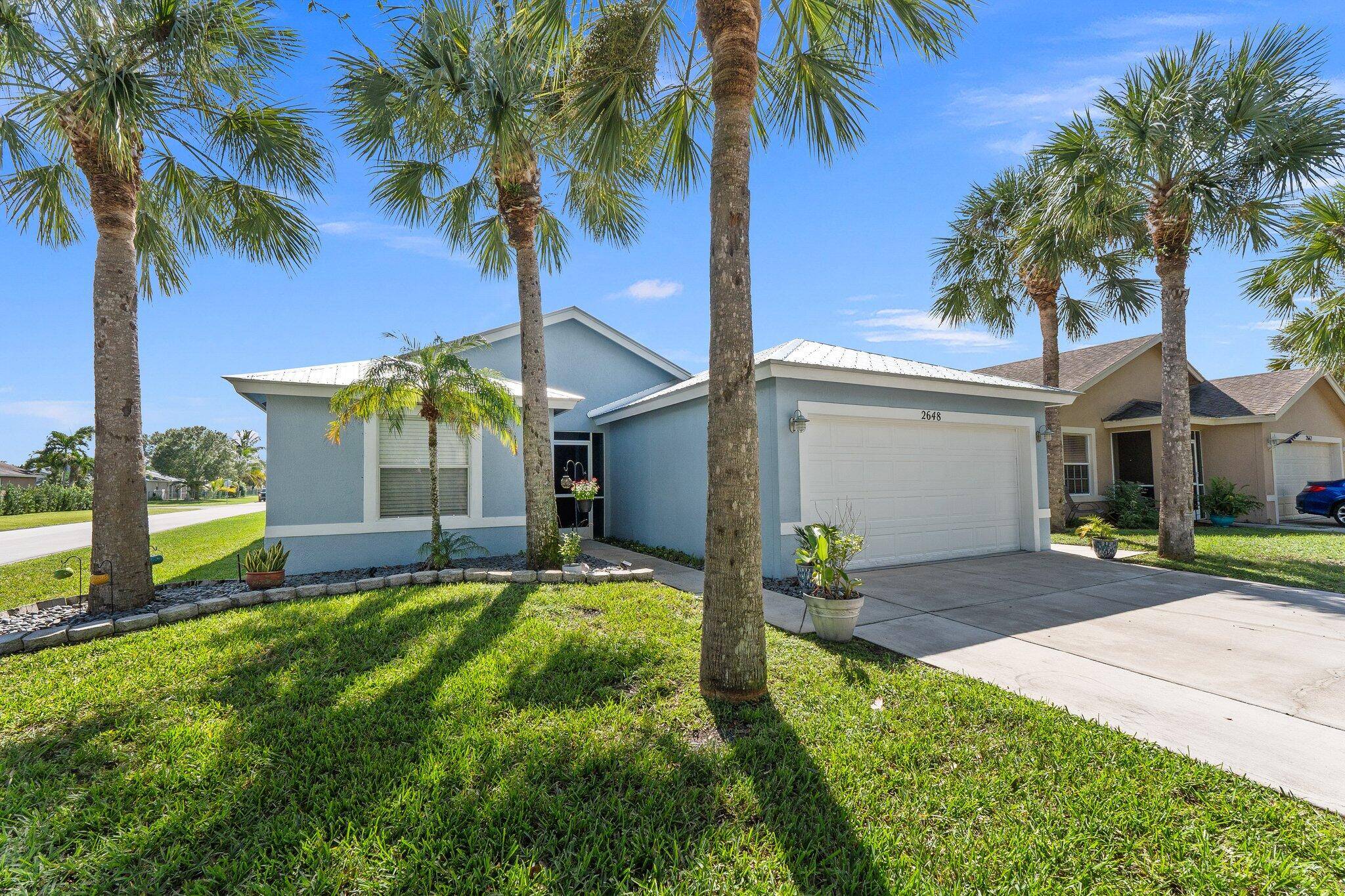 Welcome to this newly renovated 4 bedroom, 2 bathroom home where an open floor plan with vaulted ceilings creates a bright and airy space.
