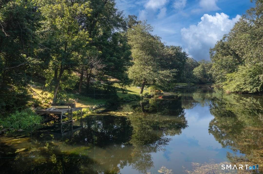 A four season retreat where open lawns, a large GUNITE POOL ready for you to swim before Memorial Day, and the surrounding landscape create a sense of quiet luxury.