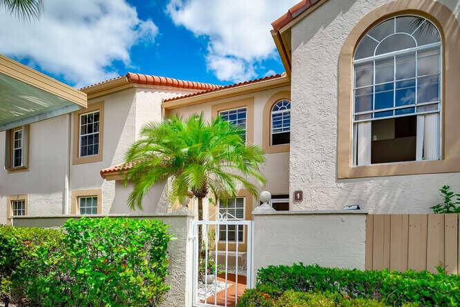 This Pristine first floor condo offers 2 Bedrooms plus a Den overlooking a beautiful lake from the private enclosed patio.