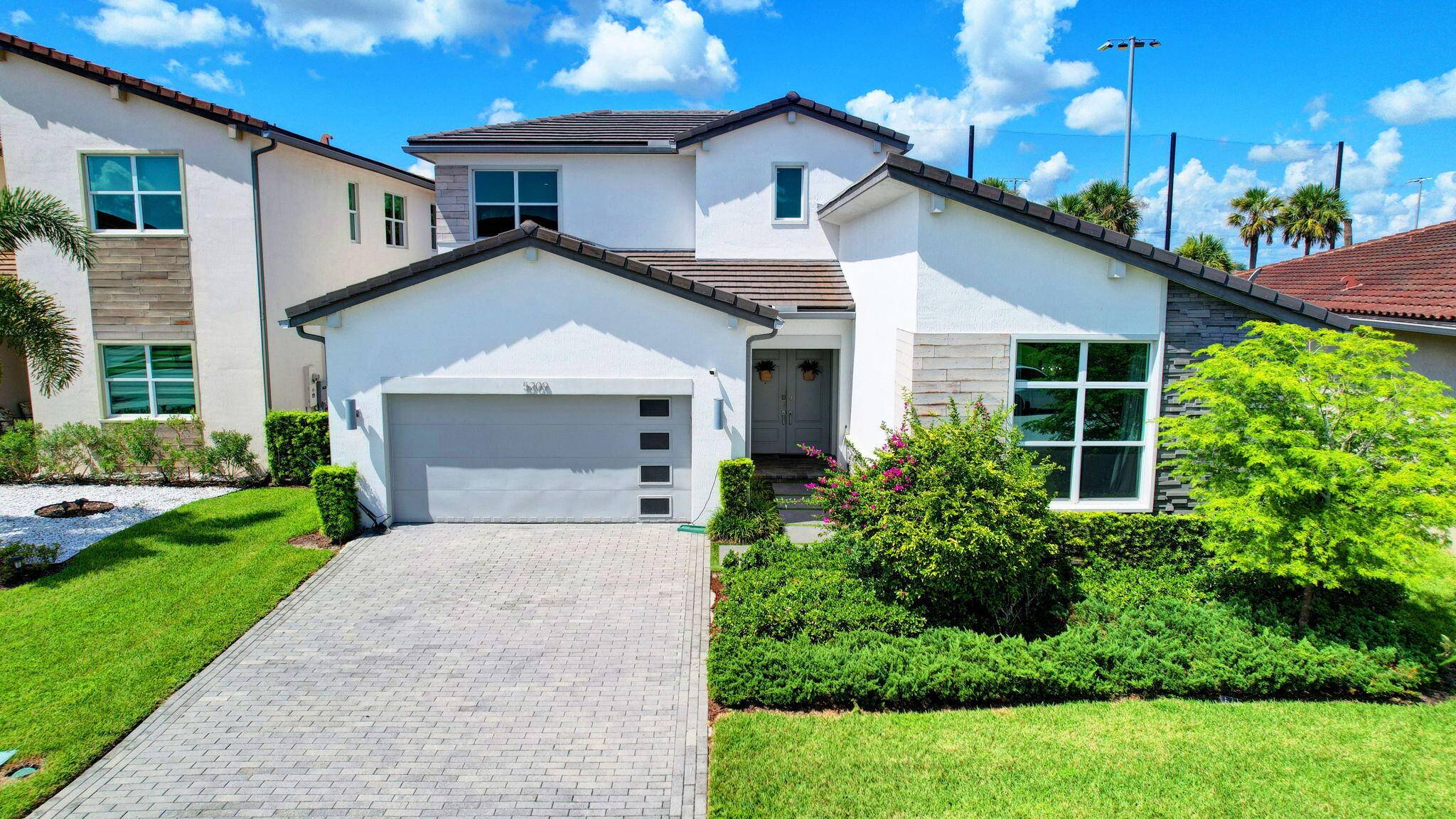 Move right into luxury in Wellington's sought after gated community of Andalucia !
