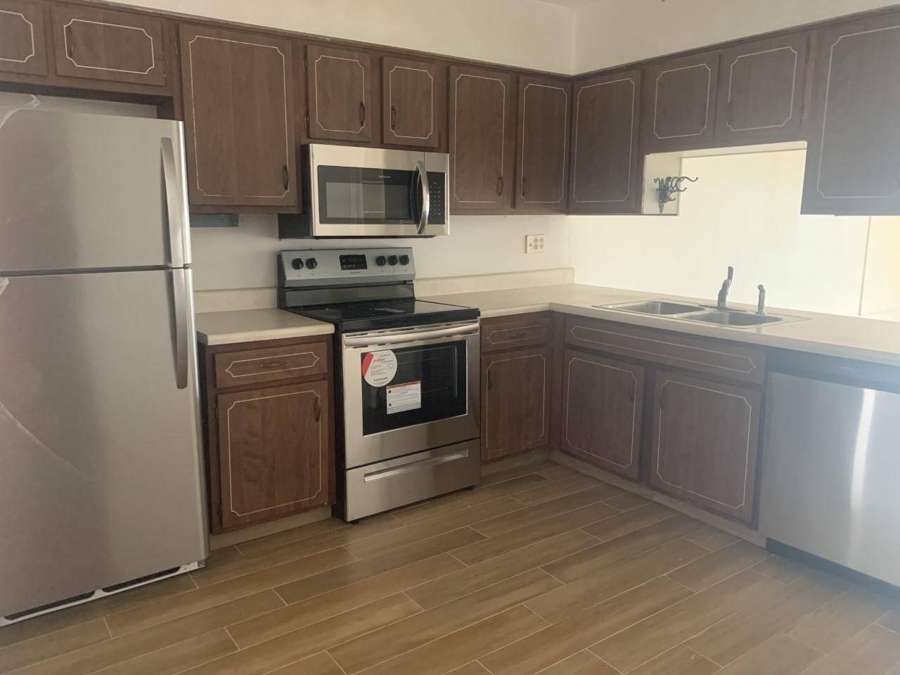 Second floor, Two Bedroom, one bath unit with brand NEW AC and NEW Wood Look TILE Floors.