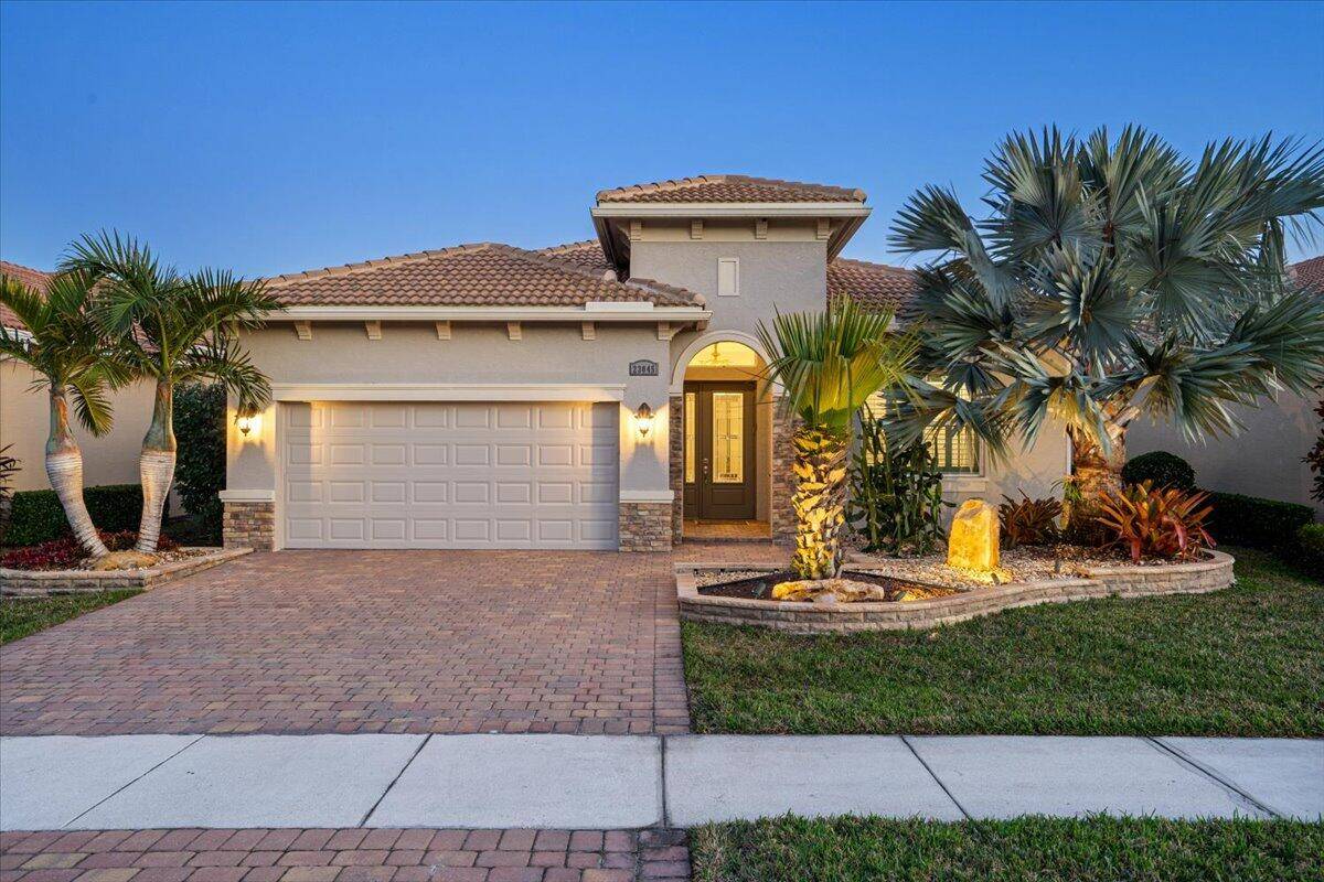 Beautiful ''Lago'' Model at Verano PGA Village with Great Curb Appeal exception tropical upgraded landscaping, solar landscape lighting, extended patio 468 sq ft WONDERFUL LAKE VIEW SETTING !