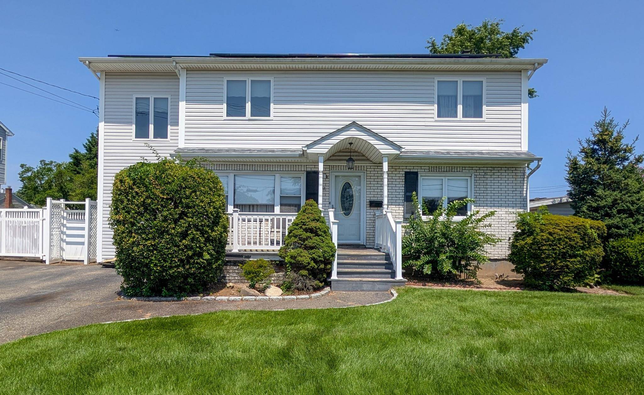 Beautiful 4 bedroom, 3 bath home with hardwood floors throughout the main level, a bright kitchen, and a partially finished walk out basement.