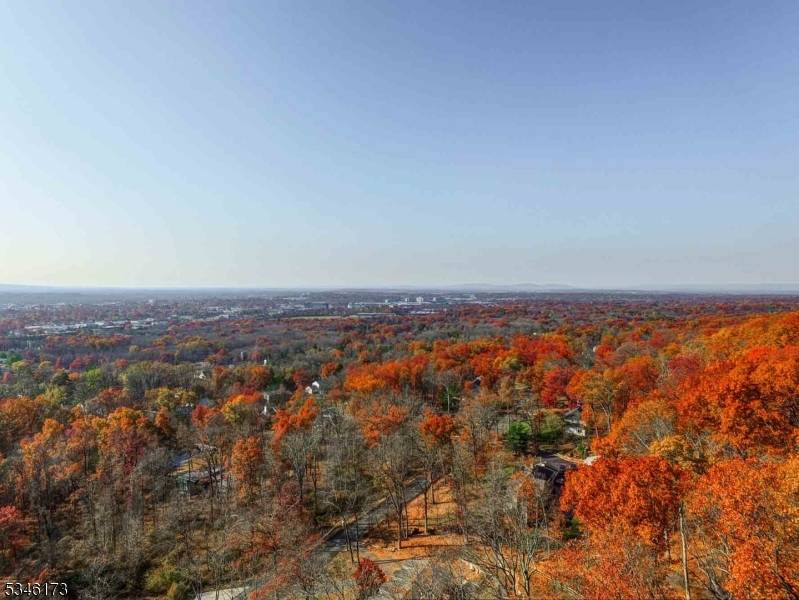 Custom Build on 1. 12 Acres on Prestigious Mountain Top Road with Distant Views and Glorious Sunsets.