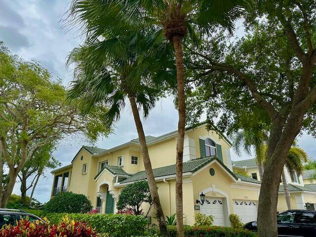 Stunning and completely renovated, second floor corner condo in The Palms community of Ballenisles.