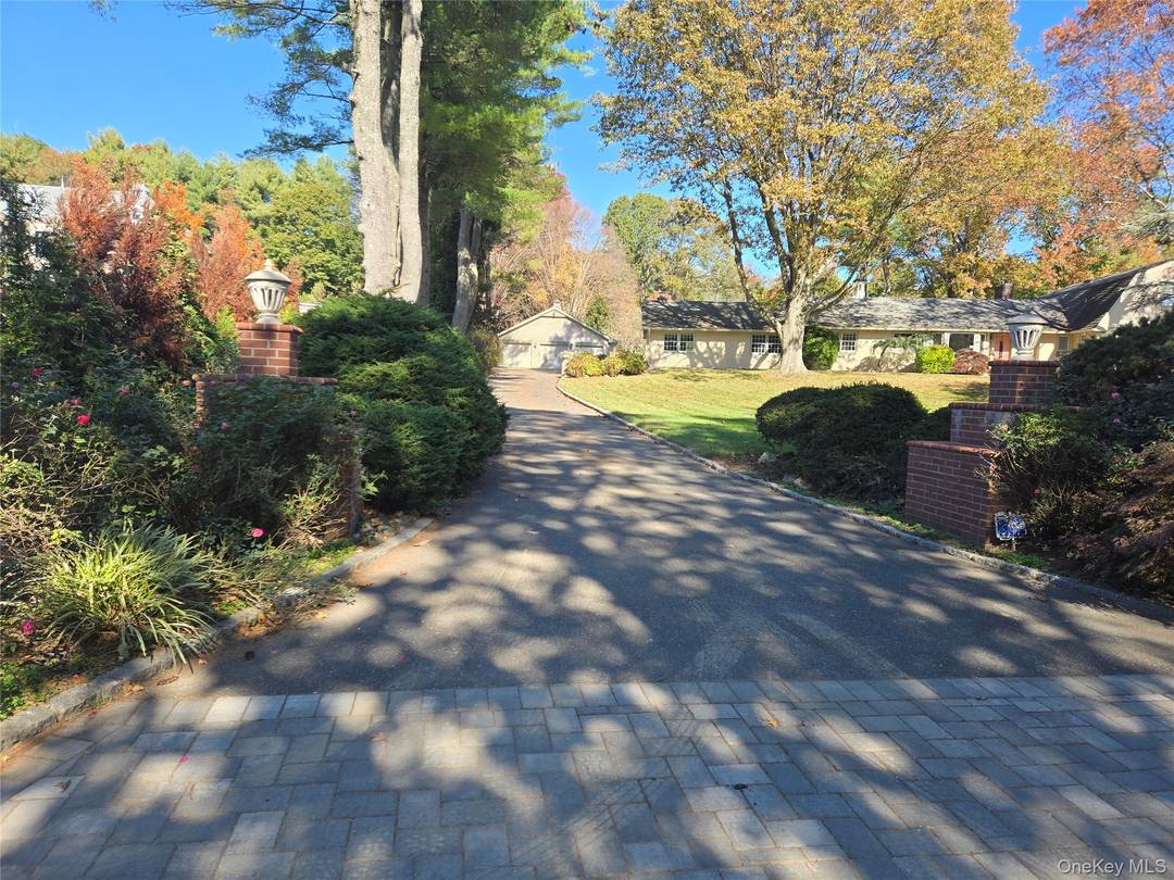 Come see this stunning brick home in the heart of Old Westbury, Jericho schools.