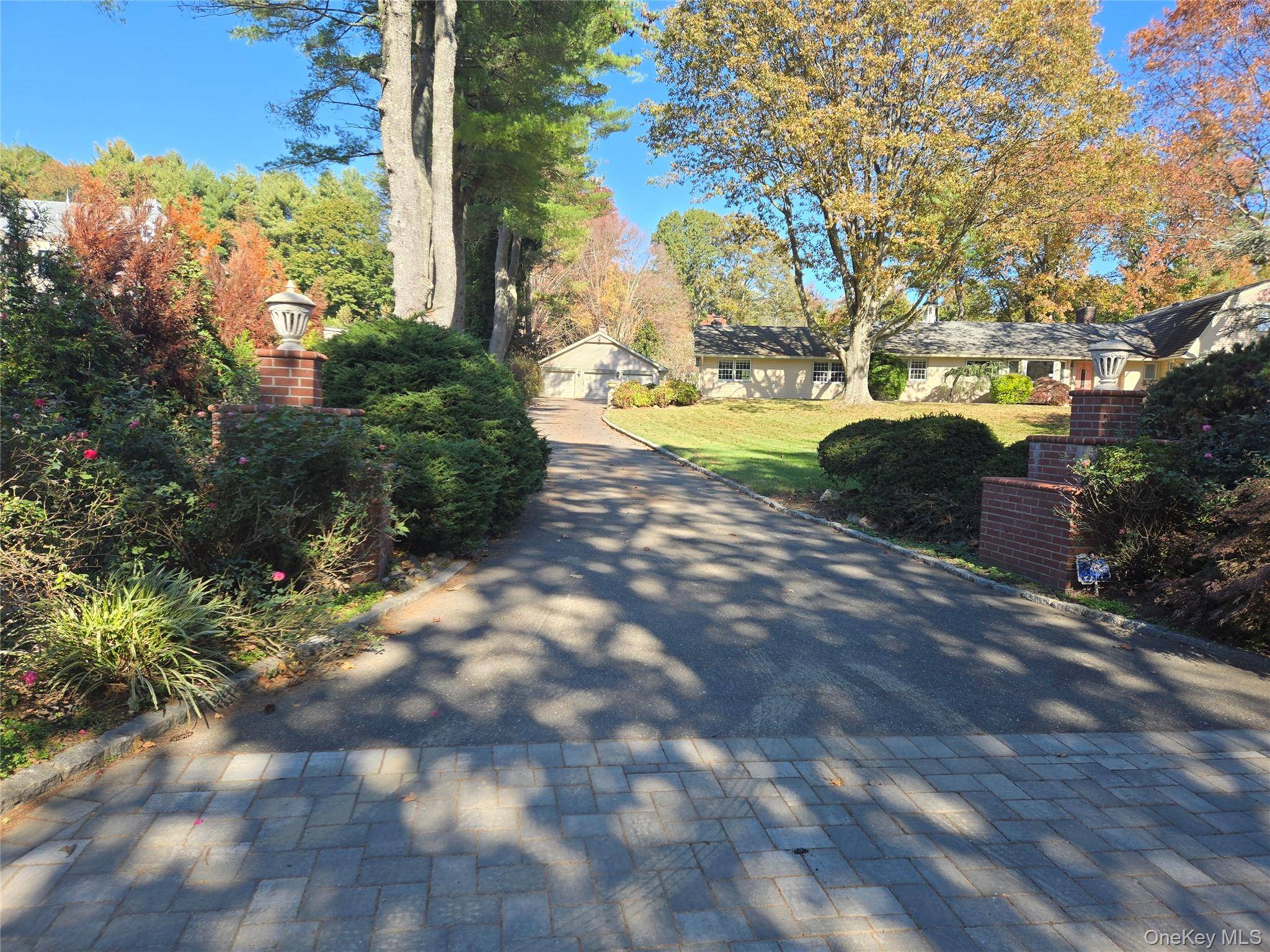 Come see this stunning brick home in the heart of Old Westbury, Jericho schools.