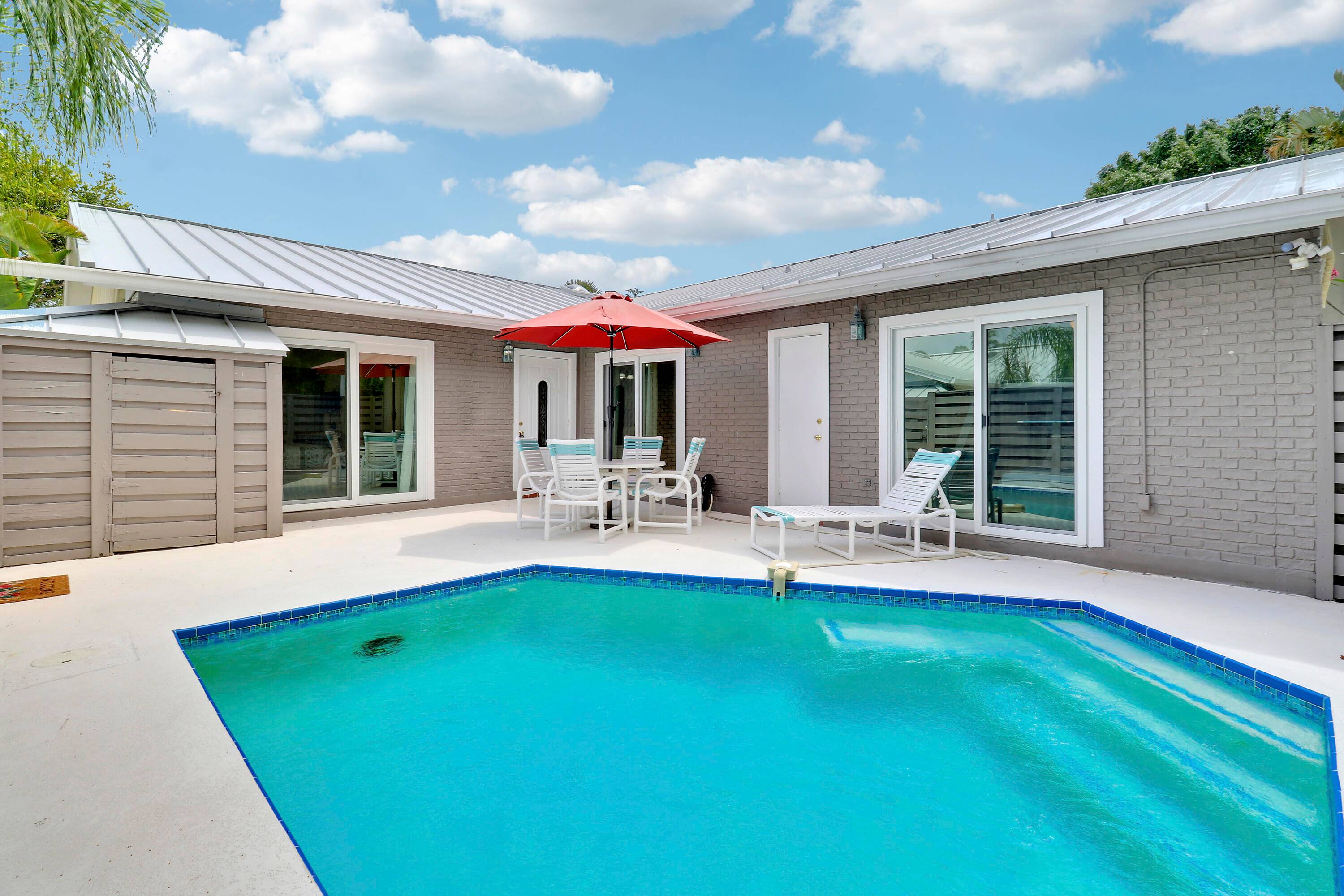 E Z Coastal living awaits you in this updated one story villa WITH PRIVATE POOL ON COURTYARD in the popular Jupiter boutique community of Oceanside Terrace.