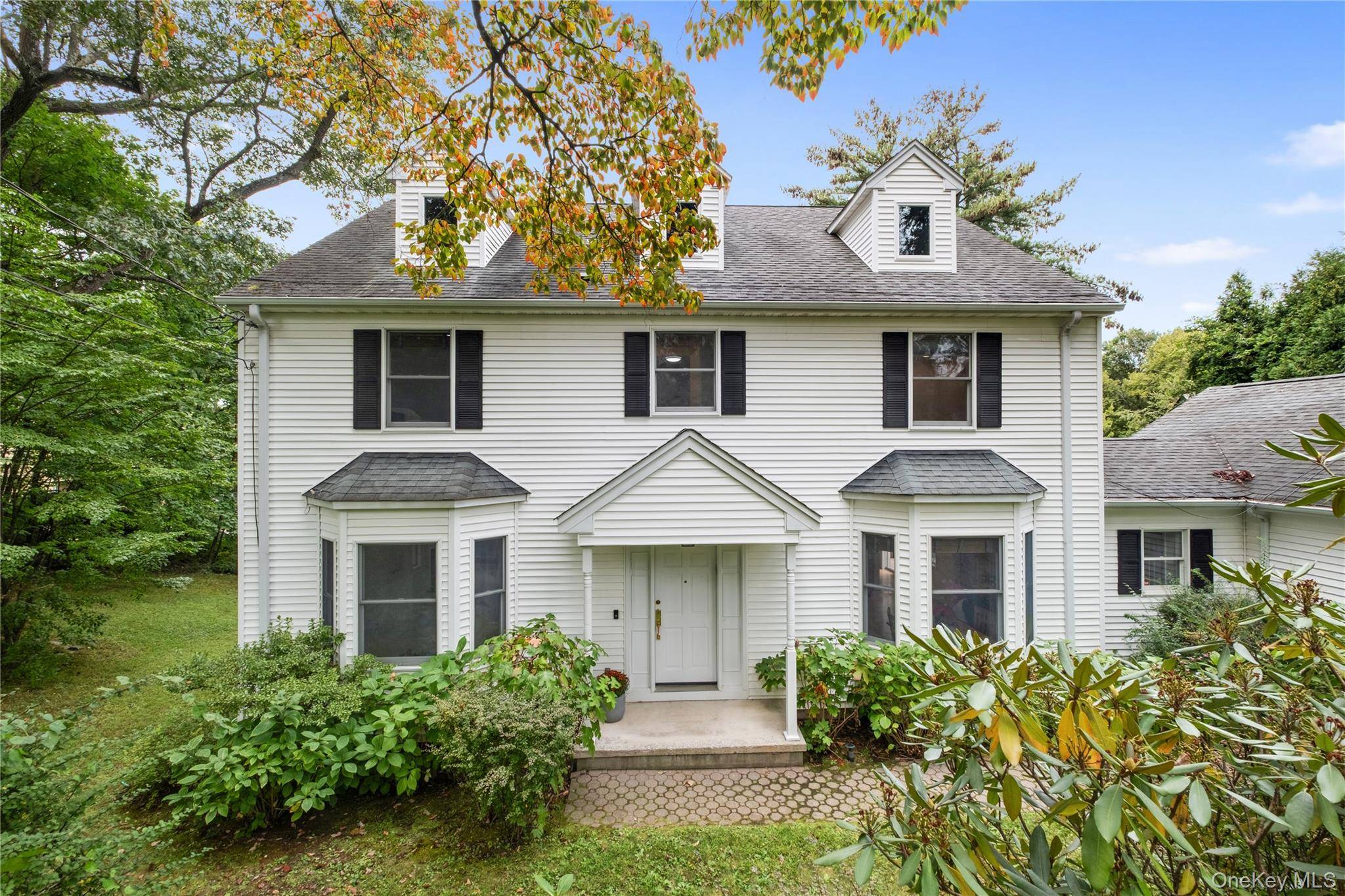 Move right in to this stunningly updated young 1998 Colonial nestled on one of the most picturesque streets in Hartsdale's Manor Woods easy walk to train !