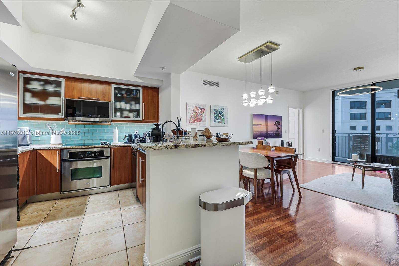 Welcome to this elegant and inviting 2 2 corner residence at Puerta de Palmas in prestigious Coral Gables.
