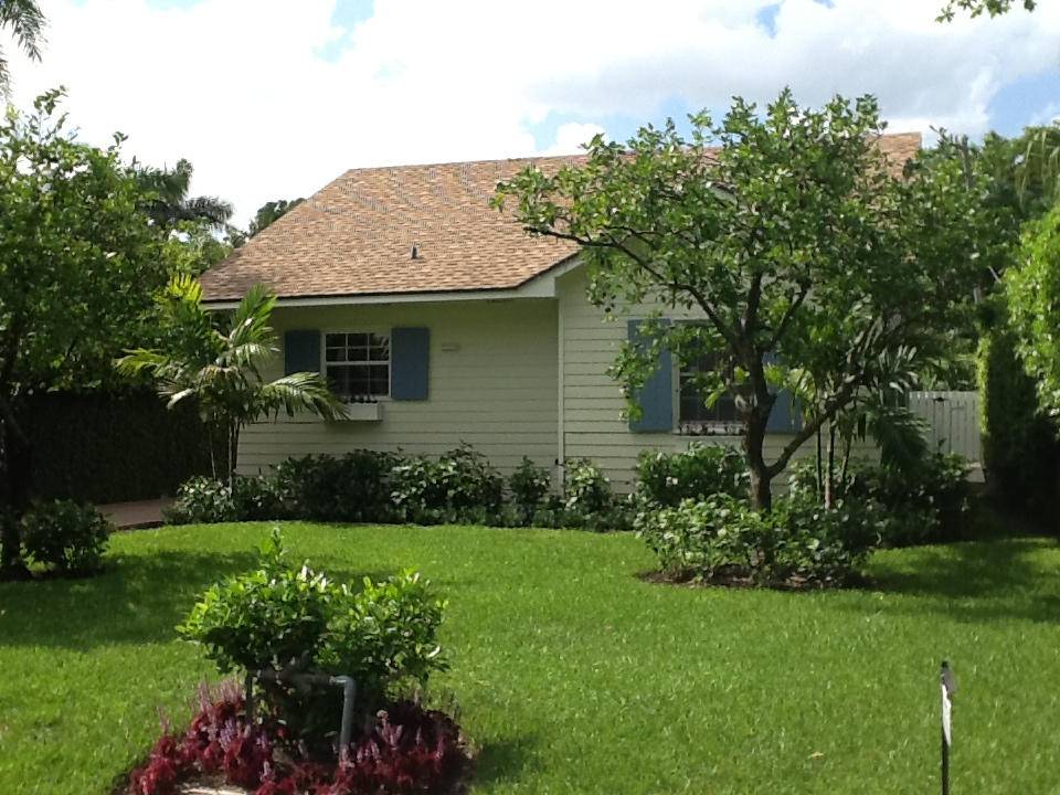 This charming 3 bedroom, 3 bath Key West style cottage has been beautifully updated and offers bright, cheerful living spaces throughout.