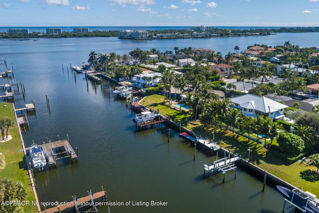 This stunning waterfront property in Lake Worth offers the perfect blend of luxury, privacy, and functionality.