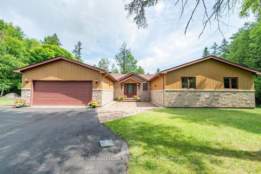 Located in a quiet, family oriented community, this spacious WALKOUT BUNGALOW SITS ON 2.