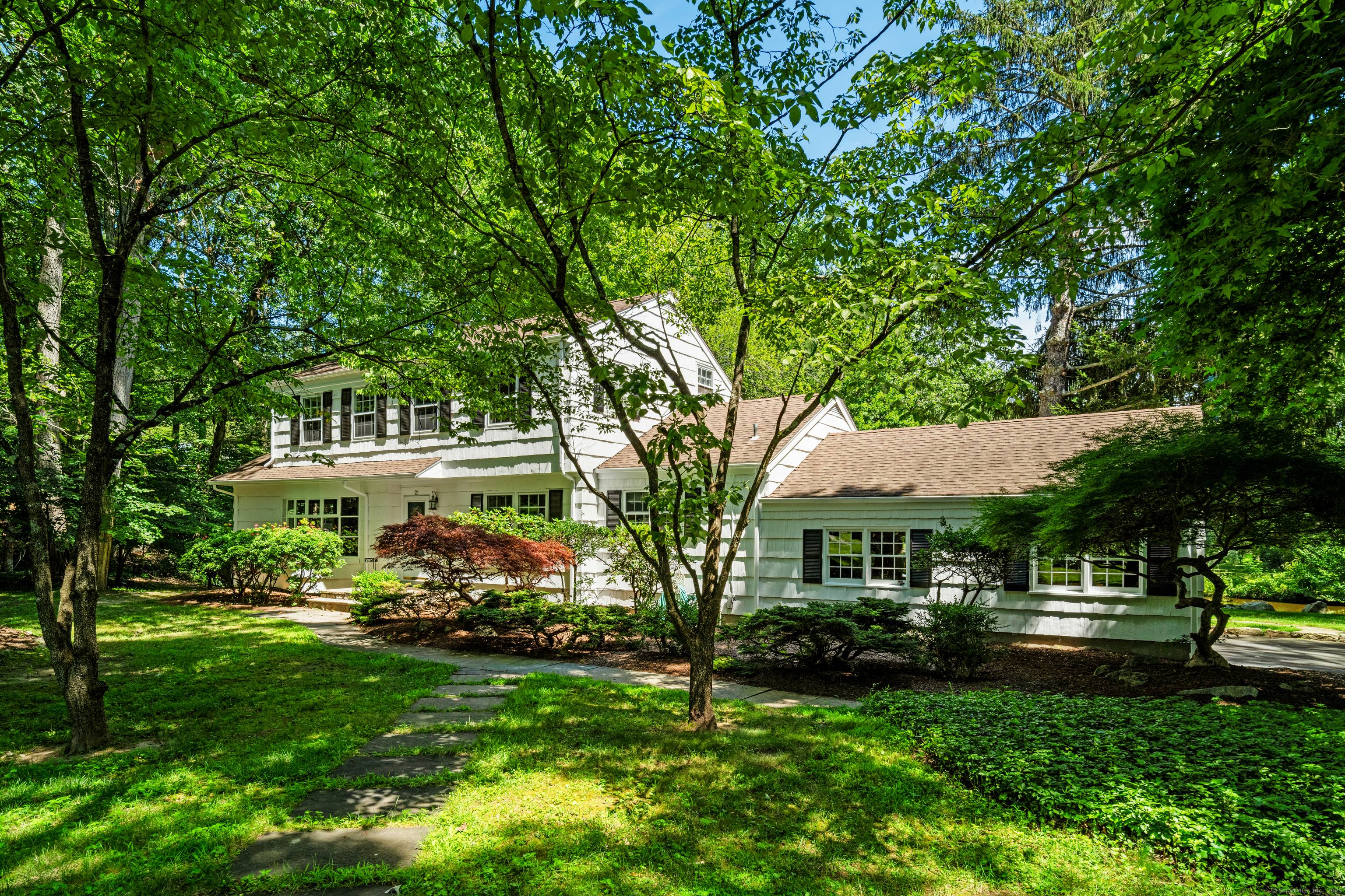 Colonial Split Level in the highly sought after Sawmill Association of North Stamford, ideally situated on a picturesque, level acre with serene pond views.