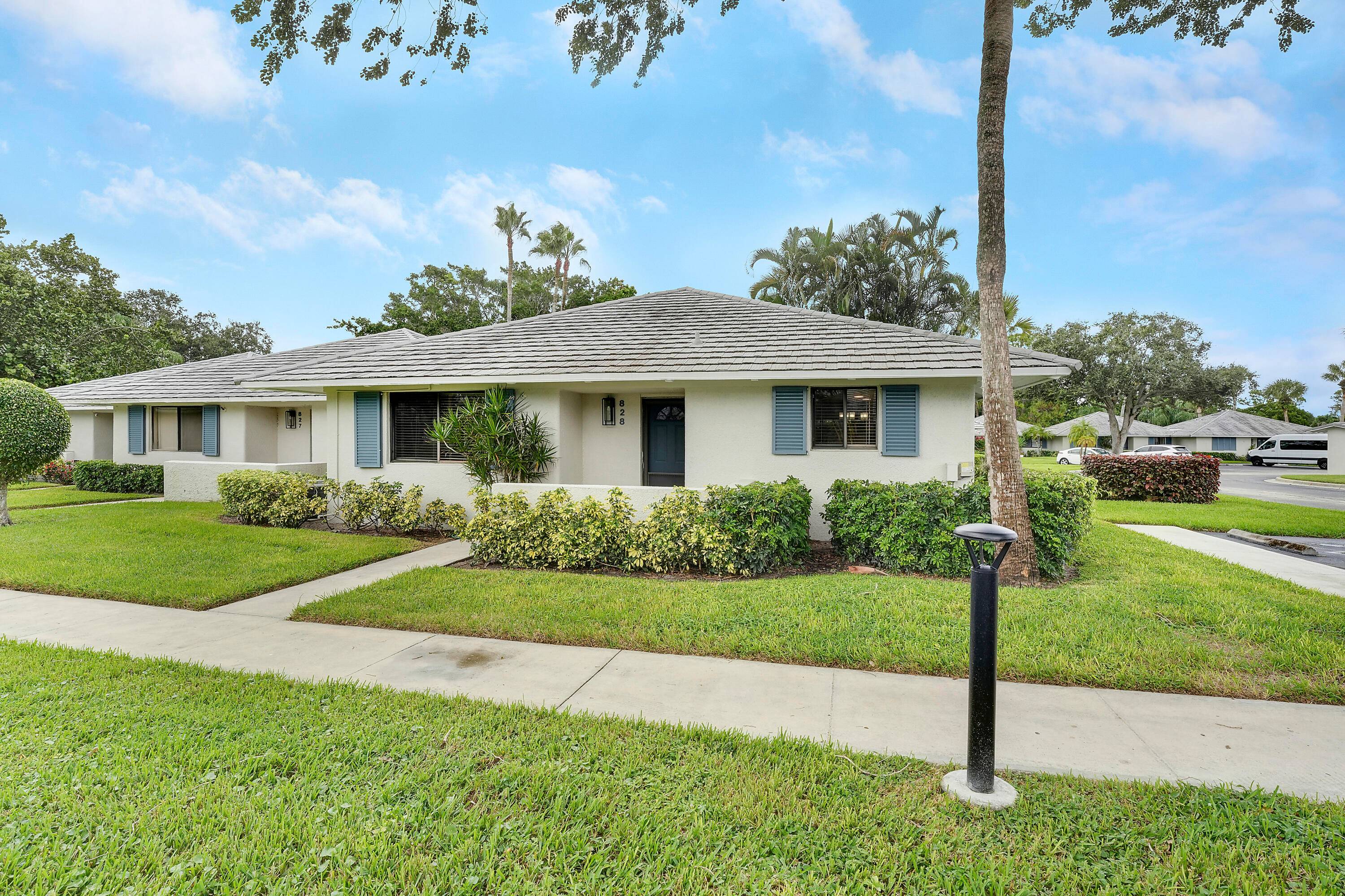 Located in the highly desirable Club Cottages within PGA National, this beautiful 2 bedroom, 2 bath corner villa offers the perfect blend of luxury, comfort and investment potential.