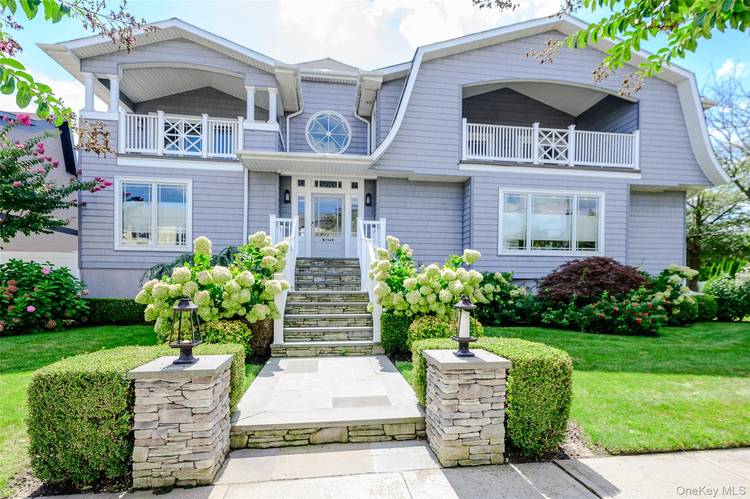 This beautiful and elegant custom contemporary home sits on a corner lot along a tree lined street in Atlantic Beach, just 23 miles from Manhattan.