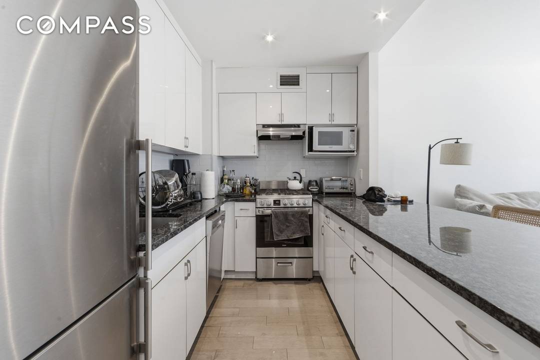 Renovated to perfection, this large 1 Bedroom home has bright and sunny west facing windows plus an oversized Island kitchen.