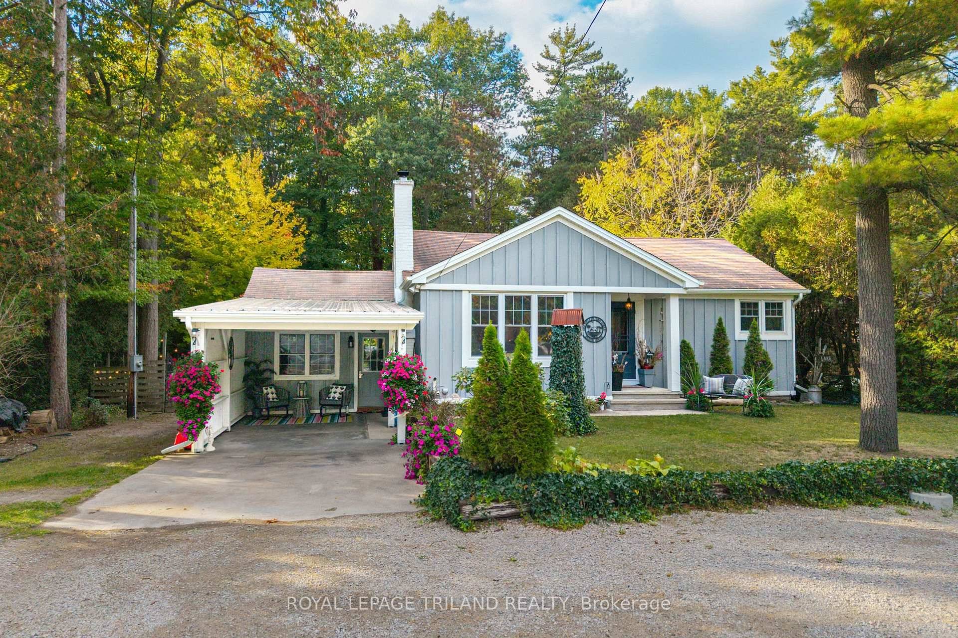 1 ACRE OF WATERFRONT PARADISE IN GRAND BEND SPECTACULARLY RENOVATED BUNGALOW WITH EXCPETIONAL RIVERSIDE BUNKY RENTAL DEFINITIVELY ONE OF THE BEST DEALS IN GRAND BEND IN TODAY'S MARKET !