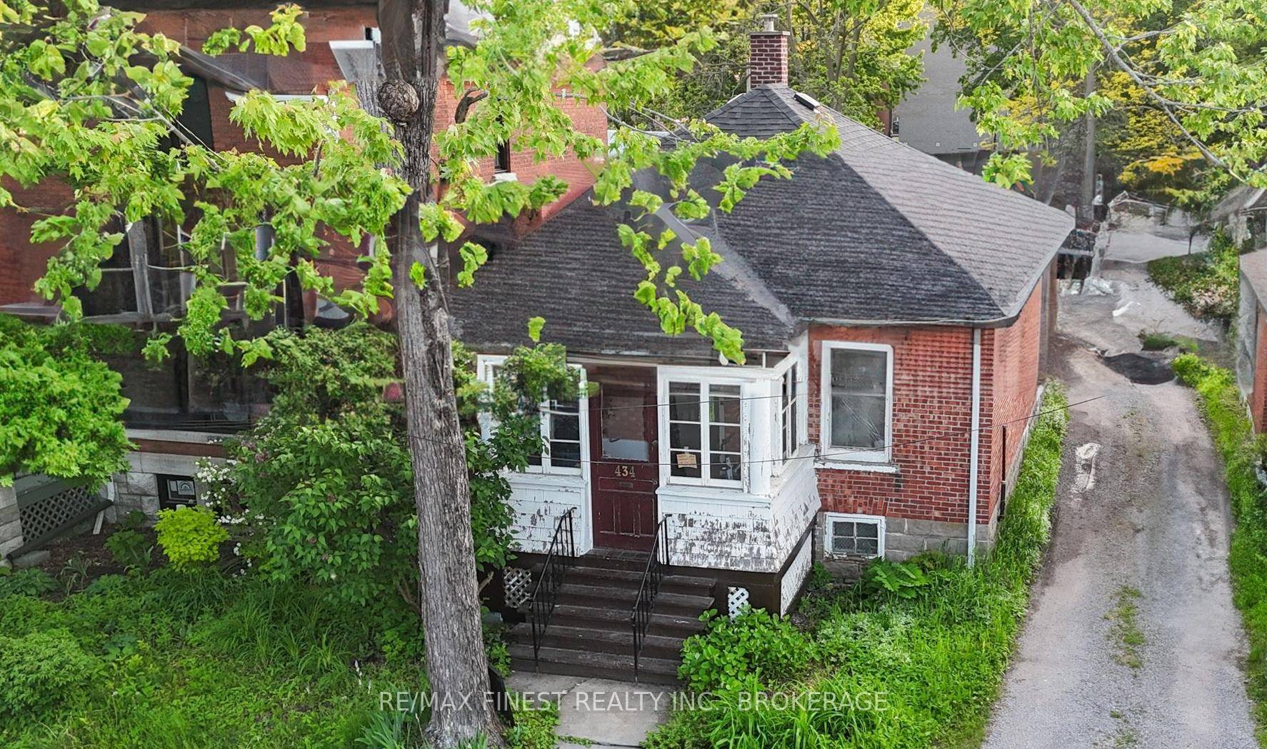 This solid brick bungalow is perfectly located just steps from Kingston's Memorial Centre and the beloved Farmers' Market.