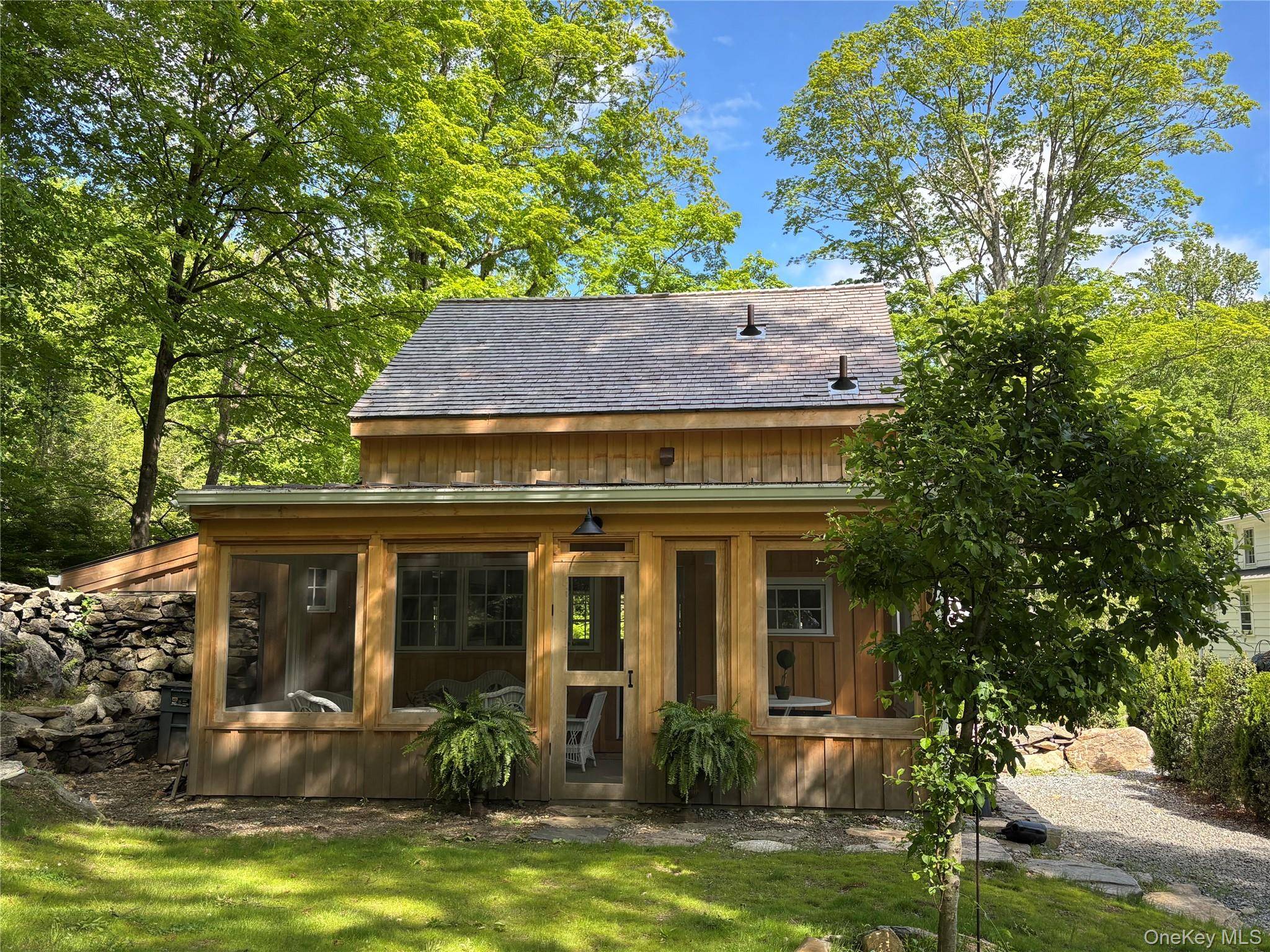 This charming rental cottage is situated in the desirable Yale Farms estate neighborhood of Armonk on two bucolic acres with stone walls, mature specimen trees and picturesque woodland views.