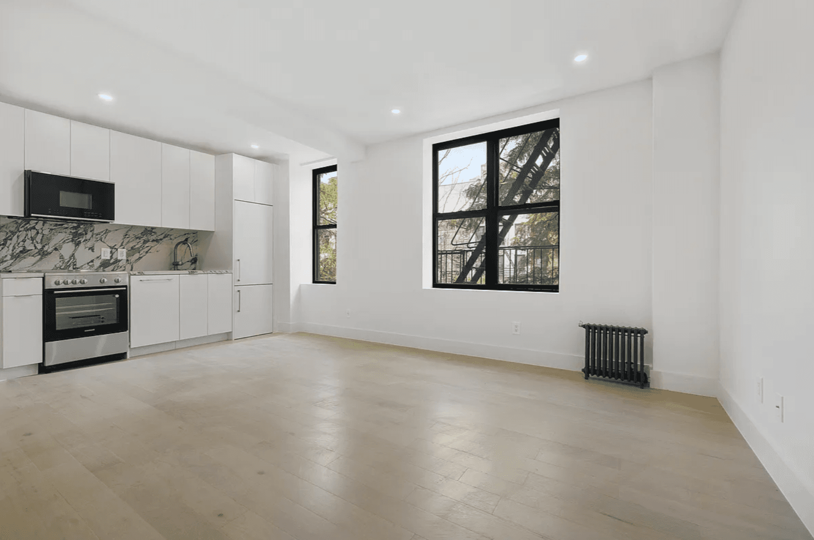 Beautifully gut renovated 2 bedroom, 1 bath residence featuring a stunning large kitchen with stainless steel appliances, wide plank Oak flooring, spacious bedrooms and in unit washer dryer.